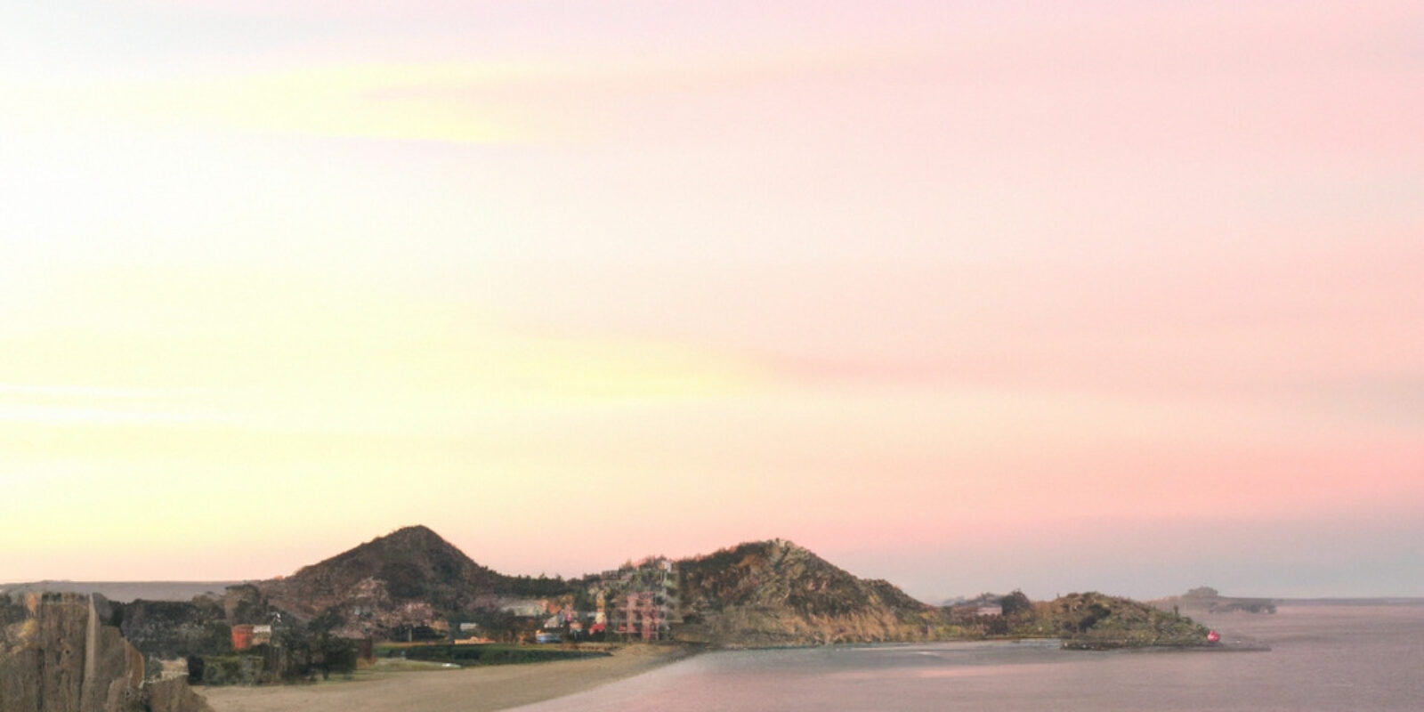 pastel sunset in cabo san lucas with a group of friends enjoying wine